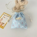 Detailed view of light blue corduroy drawstring pouch with cute floral and diamond patterns - Blue Diamond Lattice Flower