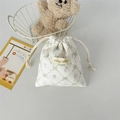 Detail of floral corduroy drawstring pouch with cute printed bow patterns and branding - White Diamond Lattice Flower