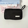 Detail of black corduroy pencil case showing fabric texture and May Rabbit label - Black