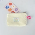 Detail of cream corduroy cosmetic bag with metal zipper and pink elastic loop - Creamy White