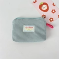 Detail of light blue corduroy pouch with metal zipper and pink woven lanyard handle - Light Blue Grey