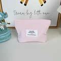 Close-up of pink waffle texture fabric and high-quality zipper on the cosmetic bag - Light Pink