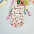Detail of floral embossed texture and May Rabbit woven label on a white phone bag - Light Pink Flower