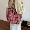 Minimalist burgundy plaid canvas tote bag with side pockets shown in daily carry scene - Wine Red Plaid (beyoumerci Label)