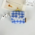 Detail of blue plaid floral earphone case with lace trim and hanging loop attachment - Large Blue Plaid