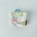 Detailed view of floral earbuds pouch with white lace trim and blue clip hook - Colorful Bow