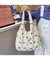 Detailaufnahme der weißen Tasche mit Bubble-Struktur und süßen Cartoon-Tiermotiven - Bubble Chiffon Schultertasche Mit Großer Kapazität / Beige Hund