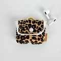 Detail of leopard print corduroy earphone case with white lace trim and button closure - Brown Leopard