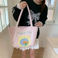 Pink heart quilted tote bag with cute fish patch and embroidery shown on model - Heart Quilted Pink Little Fish