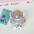 Detail of light blue floral bear print earphone case with white lace and yellow hook - Blue Base Dessert Bear