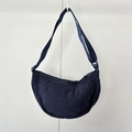 Detail of navy blue corduroy fabric texture and crescent moon crossbody bag zipper - Navy Blue