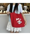 Detail of red canvas tote bag featuring cute cartoon dog embroidery and checkered handles - Picnic Dog (Red)