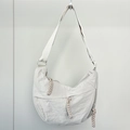 Detail of minimalist nylon dumpling bag showing pleated texture and rope zipper pulls - Off White (Small)