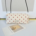 Detailed view of cream-colored floral embroidery on textured fabric with a metal zipper - Beige Floral Pencil Case