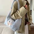 Light blue quilted heart tote bag featuring a cute animal embroidery and Lucky logo - Blue Little White Dog