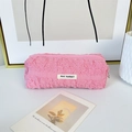 Close-up of pink ruched bubble texture pencil case with May Rabbit woven label - Pink