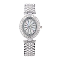 Elegant silver luxury watch for women featuring a crystal-set band and floral rhinestone dial - Silver