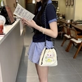 Close-up of beige canvas drawstring bag with colorful rabbit and flower embroidery - Butterfly Fairy (Beige)
