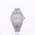 Detail view of silver luxury diamond watch with Roman numerals on a crystal dial - Silver