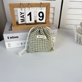Detail of green gingham drawstring bag showing cotton texture and May Rabbit label - Green Check