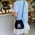 Detail of embroidered cartoon patterns on black nylon crossbody bag with drawstring - House (Black)