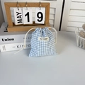Detail of blue and white checkered drawstring bag with May Rabbit label and cotton rope - Blue Plaid