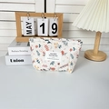 Close-up of a floral quilted cotton makeup bag with high-quality zipper detail - Spring Floral