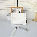 Detail view of a quilted cotton storage basket with cute rabbit and pink floral patterns - Cartoon Lamb