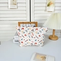 Detailed macro view of May Rabbit floral quilted makeup bag with soft cotton texture - Spring Floral