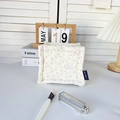 Detailed macro view of floral quilted cotton storage basket with cute rabbit patterns - Bowknot Dog
