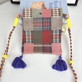 Detailed close-up of patchwork crossbody bag featuring plaid patterns and blue tassels - Ethnic Red Plaid Mini Crossbody Bag