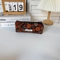 Close-up of vintage corduroy floral pencil case on desk with cozy aesthetic decor - Corduroy Daisy Floral