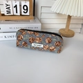 Detail of floral corduroy pencil case with May Rabbit label on a cozy desktop - Corduroy Blue Rose