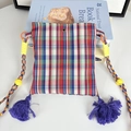 Detailed close-up of a colorful checkered fabric crossbody bag with purple tassels - Classic Striped Plaid Mini Crossbody Bag