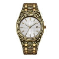 Macro detail of golden men's watch featuring intricate floral engravings and date window - Gold Case White Dial