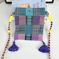 Close-up of patchwork crossbody bag with purple tassels and woven rope strap - Ethnic Blue Plaid Mini Crossbody Bag