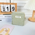 Close-up of green checkered cotton fabric pouch with zipper and MAY RABBIT label - Green Check