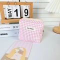 Macro detail of pink checkered fabric pouch showing zipper closure and May Rabbit label - Pink Plaid