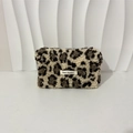 Close-up of plush leopard print makeup bag featuring a May Rabbit label and soft texture - Brown Leopard Print