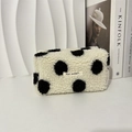 Close-up of white plush cosmetic bag with black polka dots and MAY RABBIT label - Black Polka Dot