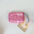Close-up of pink quilted heart pouch with premium stitching and soft blue wrist strap - Dark Pink Large Heart