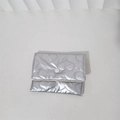 Detail of silver heart-quilted pouch showing the central snap button closure - Large Heart / Silver