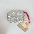Close-up of silver quilted heart coin purse with Mayrabbit label and pink strap - Silver Large Heart