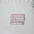 Detail of pink satin mini storage bag featuring heart-shaped quilted pattern and snap button - Large Heart / Light Pink