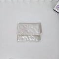 Detail of white quilted heart pattern pouch with a round snap button closure - Large Heart / Off-white