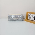 Detailed close-up of a silver quilted pencil case with a metal finish and zipper - Bubble Quilted Silver