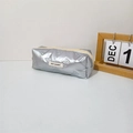 Detail of silver metallic pencil case with bow and rabbit quilting and fabric brand label - Small Bow Silver