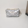 Detail of silver quilted makeup bag with rhombic pattern and May Rabbit label - Bubble Quilted Silver