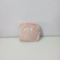 Close-up of pink plush square bag with a May Rabbit label and smooth metal zipper detail - Pink