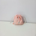 Detail of orange gingham cotton drawstring bag with light blue bow and white cord - Red Plaid